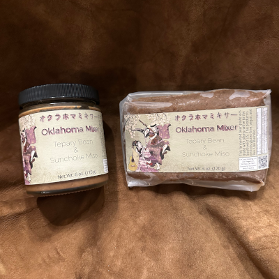 A jar of premium and a packet of standard-grade Oklahoma Mixer Miso