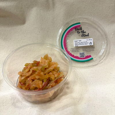 An open container of Back to the Rind Ragin Tajin